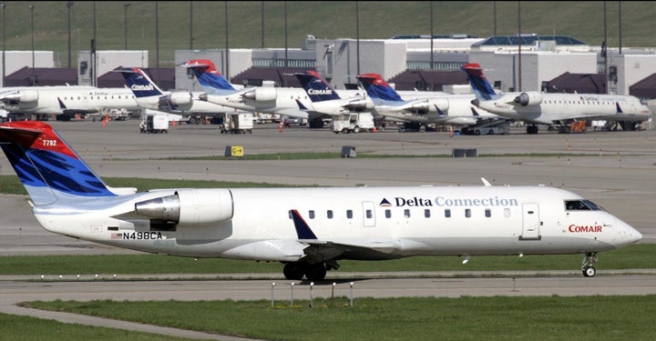 A black doctor says flight attendants questioned her medical training on a Delta connection flight to Boston. (A similar aircraft is pictured above.)