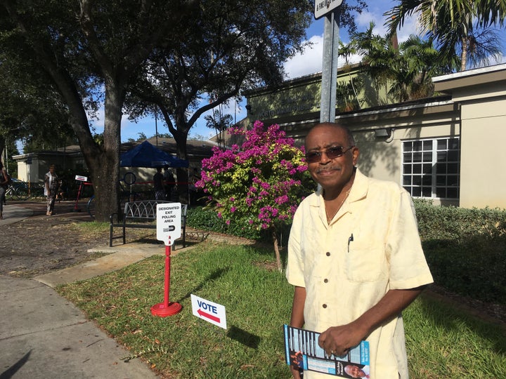 Camille Papin prepares to vote quickly for Gillum at the North Miami Public Library. Papin, 78 years old and from H