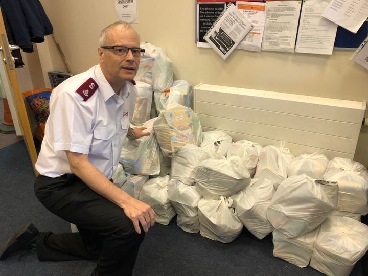 Major Alex Cadogan with some of the food bags ready for collection at the Salvation Army foodbank in Preston