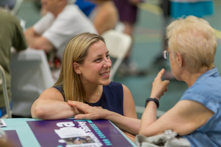 Liuba Grechen Shirley, 37, speaks to a voter in New York's 2nd Congressional District.