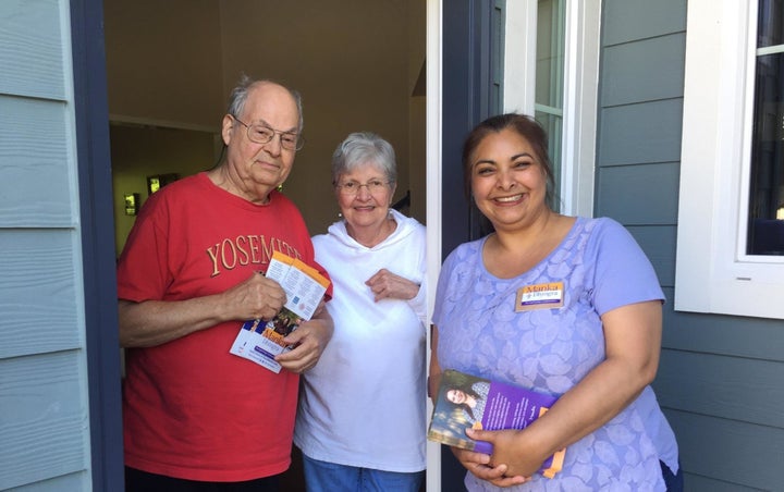 Manka Dhingra, right, speakers to voters in July 2017. Dhingra's November 2017 win in a Washington state Senate election won Democrats unified control of state government.