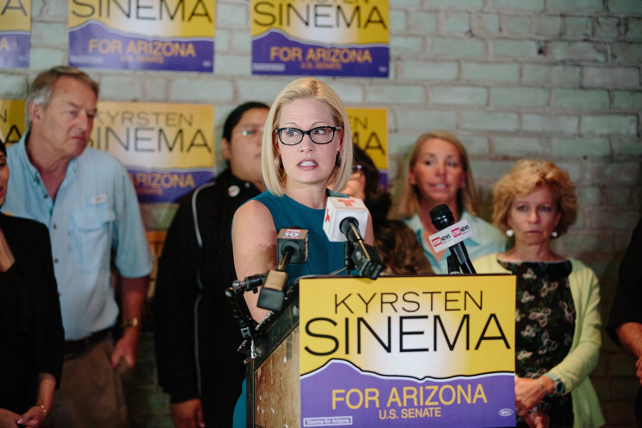 Sinema answers questions at a campaign event in Phoenix on Oct. 24.