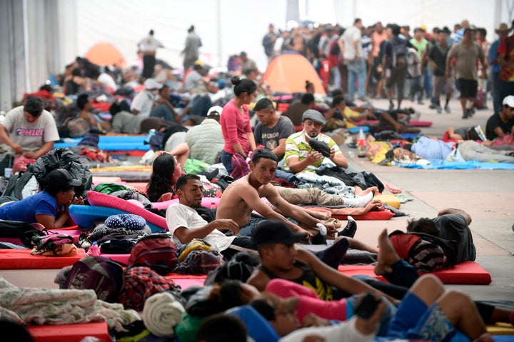 Central American migrants, part of a caravan heading to the U.S., rest at a temporary shelter set up in a Mexico City stadium on Nov. 5, 2018.