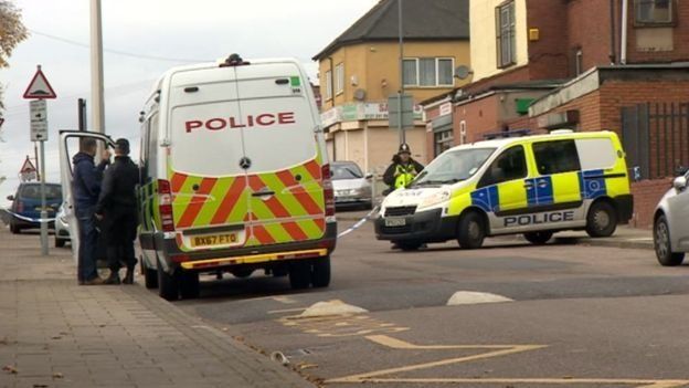 Police comb the scene for clues after a double shooting at a Halloween party in Birmingham