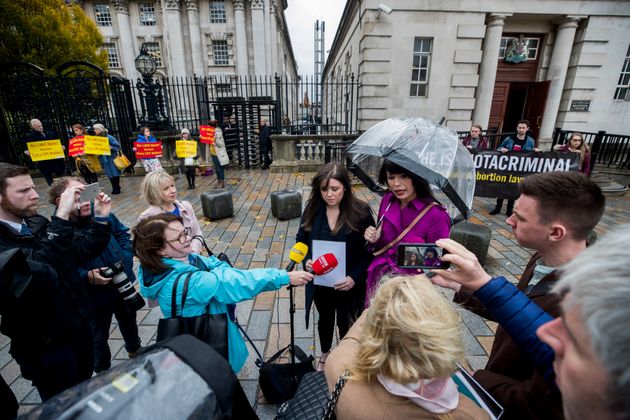 Conlon (left) speaking to media this morning 