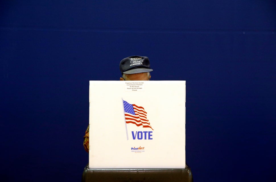 A voter fills out a ballot at a polling place at Lake Shore Elementary School, Tuesday, Nov. 6, 2018, in Pasadena, Maryland. 