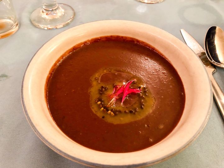 Red bean soup, topped with Staghorn sumac oil (not sunflowers, which are suggested in the recipe).