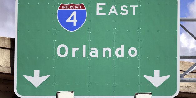 'Highway Sign pointing to Orlando, FL. Home of several family entertainment sites like Disney World, Universal Studios and Sea World.'