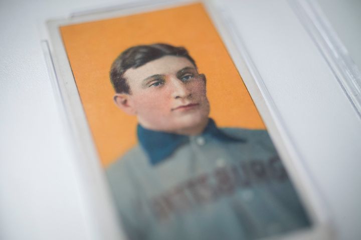 The 1909 baseball card of Pittsburgh Pirates shortstop Honus Wagner is displayed for a photograph in New York, U.S., on Tuesday, Feb. 19, 2013. The trading card that the National Baseball Hall of Fame calls the sport's 'most famous collectible' will be up for sale starting Feb. 25, and might fetch more than $2.8 million, according to the auction house. Photographer: Scott Eells/Bloomberg via Getty Images