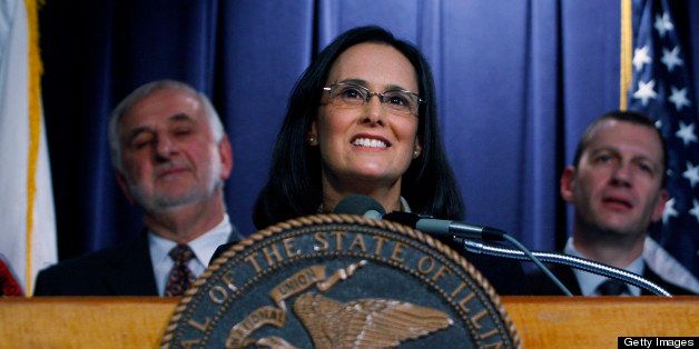 CHICAGO - DECEMBER 12: Illinois Attorney General Lisa Madigan (C) speaks about Illinois Governor Rod Blagojevich during a press conference at The Thompson Center December 12, 2008 in Chicago, Illinois. Madigan has asked the Illinois Supreme Court to declare Blagojevich unfit as governor after he was arrested on December 9 by FBI Agents and charged with attempting to sell the U.S. Senate seat vacated by U.S. President-elect Barack Obama for money and favors. (Photo by Joshua Lott/Getty Images)