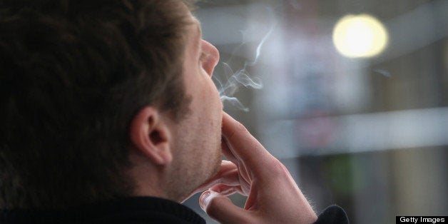 NEW YORK, NY - APRIL 23: A smoker enjoys a cigarette outside an office building on April 23, 2013 in New York City. The legal age to buy cigarettes could rise to 21 from 18 in New York City under a proposal officials released this week, making New York the strictest of any major U.S. city on smoking age limits. (Photo by John Moore/Getty Images)