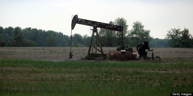 A pump jack works on Wednesday, April 4, 2012, in Cisne, Illinois, as nearby areas are marked for the start of fracking opera