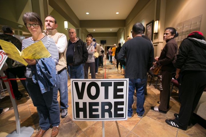 Voters line-up to cast their ballots at a polling station set up at Noonday Baptist Church for the mid-term elections on November 6, 2018 in Marietta, Georgia.
