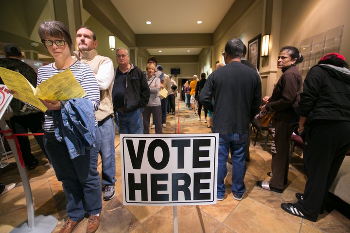 Voters line-up to cast their ballots at a polling station set up at Noonday Baptist Church for the mid-term elections on November 6, 2018 in Marietta, Georgia.