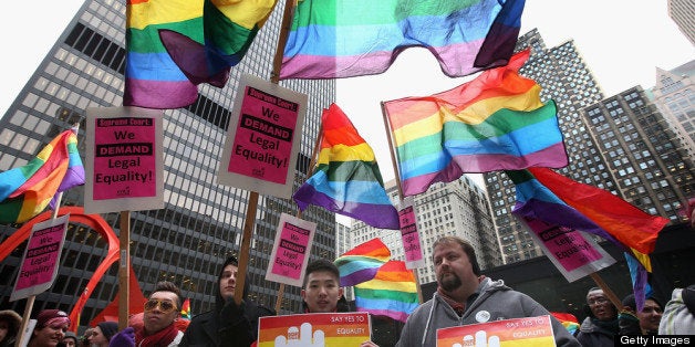 CHICAGO, IL - MARCH 25: Gay rights activist rally in support of gay marriage March 25, 2013 in Chicago, Illinois. The Supreme Court will hear arguments this week in two cases that could determine if states or the federal government can treat same-sex couples and those of the opposite sex differently when recognizing a marriage. The Illinois Senate has approved legislation that will legalize same-sex marriage in the state but it still has to be approved by the Illinois House and signed by Governor Pat Quinn, who has said he supports the legislation. If passed Illinois would become the tenth state to allow same-sex marriage. Thirty states have defined marriage as a union between a man and a woman. (Photo by Scott Olson/Getty Images)