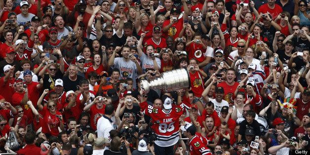 The Chicago Blackhawks' Patrick Kane (88) hoists the Stanley Cup aloft for the crowds during the Stanley Cup victory parade and celebration in Chicago, Illinois, Friday, June 11, 2010. (Will DeShazer/Chicago Tribune/MCT via Getty Images)