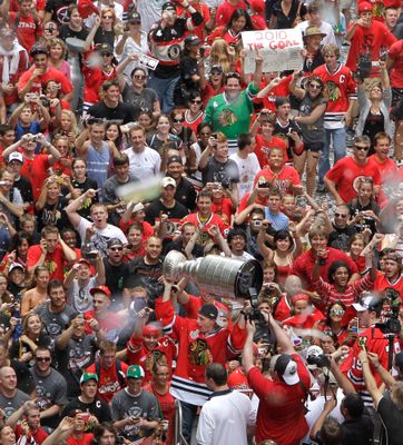 Jun 11, 2010 - Chicago, Illinois, U.S. - Fan carries fake Stanley cup on  Wacker Drive. Parade on Michigan Avenue to celebrate the Stanley Cup 2010  championship win of the Chicago Blackhawks