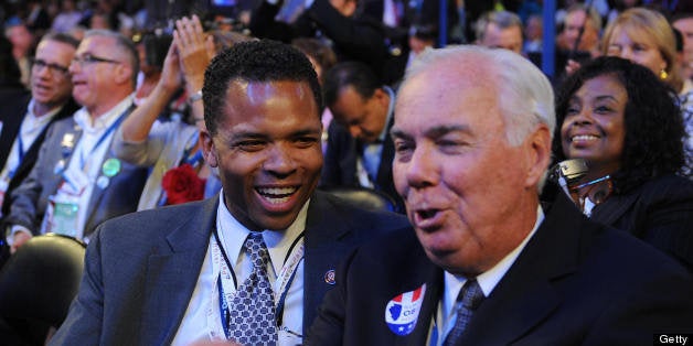 Jesse Jackson Jr., member of the House of Representatives of Illinois, listens to Richard Mell (R), Chicago City Council, at the Democratic National Convention 2008 at the Pepsi Center in Denver, Colorado, on August 26, 2008. Hillary Clinton takes center stage tonight vowing to unite Democrats after her primary battle with Barack Obama, on the second day of the convention that will crown him as White House nominee. The DNC is held 25-28 August. AFP PHOTO Stan HONDA (Photo credit should read STAN HONDA/AFP/Getty Images)