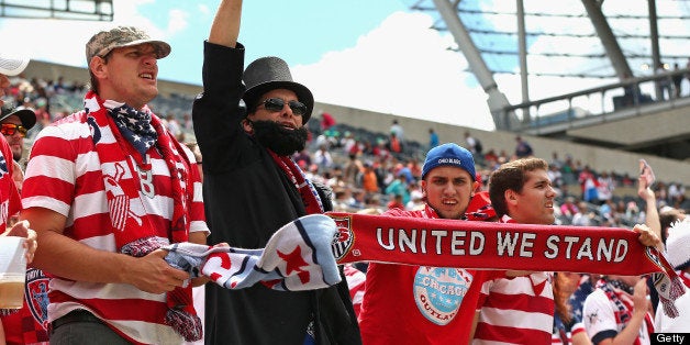 CHICAGO, IL - JULY 28: Fans of the United States cheer as their team enters the field for warm-ups before taking on Panama during the CONCACAF Gold Cup final match at Soldier Field on July 28, 2013 in Chicago, Illinois. The United States defeated Panama 1-0. (Photo by Jonathan Daniel/Getty Images)