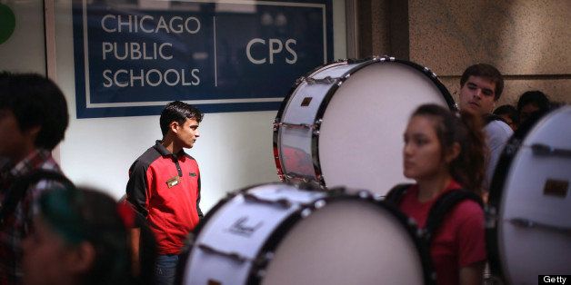 CHICAGO, IL - JULY 11: Members of the Kelly High School marching band drum line lead demonstrators to the Chicago Public Schools headquarters to protest funding and staff cuts to their neighborhood schools on July 11, 2013 in Chicago, Illinois. Earlier this year Chicago Public Schools announced it will close more than 50 elementary schools shifting 30,000 students and eliminating or relocating 1,000 teaching jobs as the school board tries to rein in a looming $1 billion budget deficit. (Photo by Scott Olson/Getty Images)