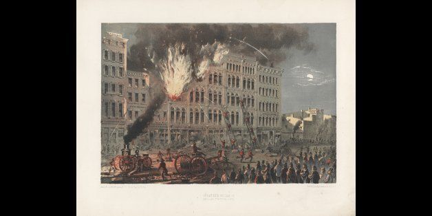 Lithograph (after drawing by Louis Kurz) of a building on fire on Lake Street (between Market and Franklin Streets) during the Great Chicago Fire, Chicago, Illinois, early 1870s. (Photo by Chicago History Museum/Getty Images)