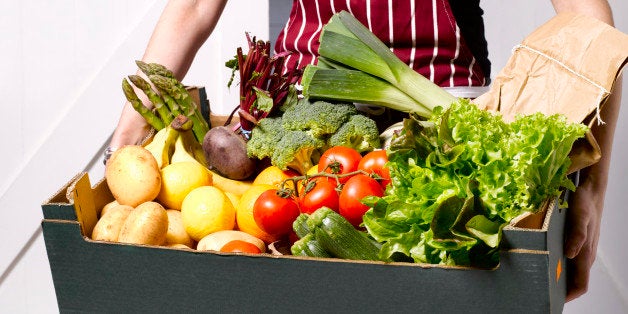 Woman delivering fruit and vegetable box