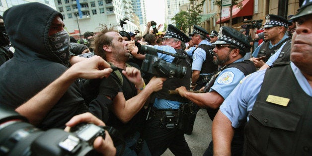 CHICAGO, IL - MAY 20: Police clash with demonstrators protesting the NATO Summit during a march through downtown streets on