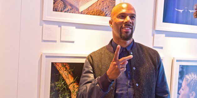 CHICAGO, IL - OCTOBER 01: Grammy Award-Winning Musician and Noted Actor Common featuring a photograph printed on the Canon PIXMA PRO printers at the Canon PIXMA PRO City Senses Gallery event at Ignite Glass Studios on October 1, 2013 in Chicago, Illinois. (Photo by Tasos Katopodis/Getty Images for Canon)