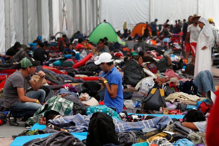 Central American migrants settle in a shelter at the Jesus Martinez stadium in Mexico City, Tuesday, Nov. 6, 2018. 