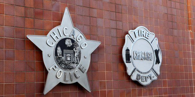 CHICAGO - JANUARY 19: The Chicago Police and Chicago Fire Department badges, are displayed on front of the City Of Chicago Public Safety Headquarters, in Chicago, Illinois on JANAURY 19, 2013 (Photo By Raymond Boyd/Michael Ochs Archives/Getty Images)