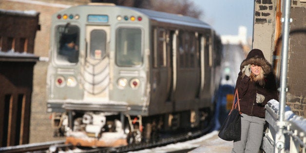 CHICAGO, IL - JANUARY 07: A passenger waits on an 'L' platform for the train to arrive in below zero temperatures on January 7, 2014 in Chicago, Illinois. Many trains were delayed on the system because doors on the trains kept freezing open. Chicago is experiencing its third consecutive day of below zero temperatures. (Photo by Scott Olson/Getty Images)