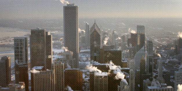 CHICAGO, IL - JANUARY 07: Steam rises from downtown buildings as temperature begin to climb above zero for the first time in more than 30 hours on January 7, 2014 in Chicago, Illinois. The cold weather has closed schools, wreaked havoc on public transportation and forced more than 1,500 flights to be cancelled at O'Hare Airport. (Photo by Scott Olson/Getty Images)