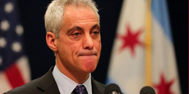 Chicago Mayor Rahm Emanuel bites his lip as he listens to a question from a reporter during a press conference on Tuesday, De