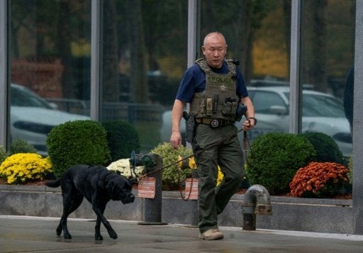 A member of the U.S. Marshals Service patrols outside the courthouse where jury selection for Joaquin "El Chapo" Guzman's tri