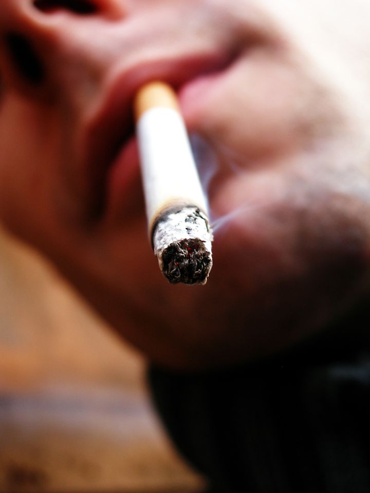 close up of a male smoker