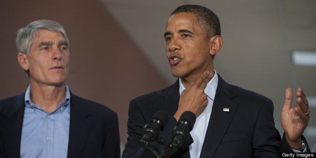 US President Barack Obama speaks alongside Colorado Senator Mark Udall as he retells a story he heard from one of the victims about holding her fingers on her best friends neck to stop bleeding following the shootings, during a visit at the University of Colorado Hospital in Aurora, Colorado, July 22, 2012, following a visit with victims and family members of last week's shootings during a midnight showing of the new Batman movie, 'The Dark Knight Rises,' at a nearby movie theater that left 12 killed and 58 injured. AFP PHOTO / Saul LOEB (Photo credit should read SAUL LOEB/AFP/GettyImages)