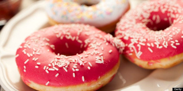 Fresh donuts on plate at breakfast