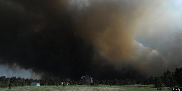 A fire burns toward a home next to Black Forest Road in Colorado Springs, Colorado, Tuesday, June 11, 2013. (Christian Murdock/Colorado Springs Gazette/MCT via Getty Images)