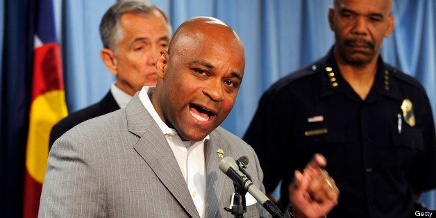 Denver Mayor Michael Hancock talks as Police Chief Robert White and Denver Manager of Safety Alex Martinez, background, listen at the press conference about the shooting death of Denver Police officer Celena Hollis at a press conference on Monday, June 25, 2012. Cyrus McCrimmon, The Denver Post (Photo By Cyrus McCrimmon/The Denver Post via Getty Images)