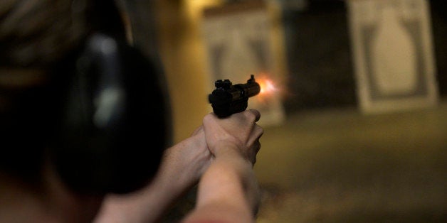 CENTENNIAL, CO. - JULY 27: Catherine Williams fires her handgun during a Multi-State Concealed Carry class at the Centennial Gun Club shooting range in Centennial, CO July 27, 2013. The number of people seeking a concealed carry gun permit in Colorado has increased by 87 percent from last year. Williams said she decided to take the class after seeing a recent video of a New Jersey mother being beaten during a home invasion. (Photo By Craig F. Walker / The Denver Post)