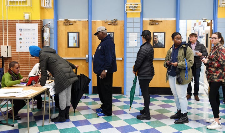 Voters register at a polling station in New York on Nov. 6.