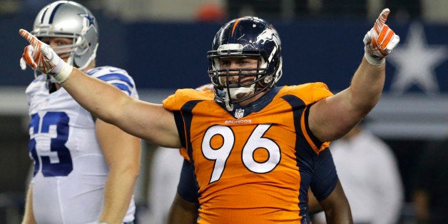 Denver Broncos defensive tackle Mitch Unrein (96) celebrates sacking Dallas Cowboys quarterback Dustin Vaughan as guard Steph