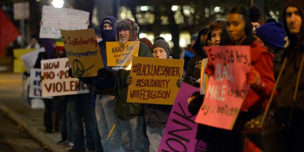 DENVER, CO - NOVEMBER 25: A group of more than 300 gathered November 25, 2014 at Civic Center Park to join in Solidarity with Ferguson Protesters in an ongoing peaceful movement against police brutality. The group then marched down through downtown Denver to the detention center. (Photo By John Leyba/The Denver Post via Getty Images)