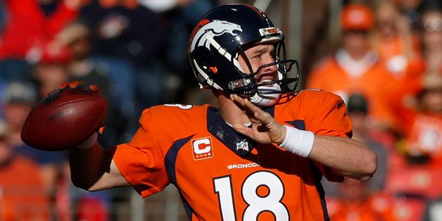 Denver Broncos quarterback Peyton Manning throws against the Buffalo Bills during the first half in an NFL football game Sunday, Dec. 7, 2014, in Denver. (AP Photo/David Zalubowski)