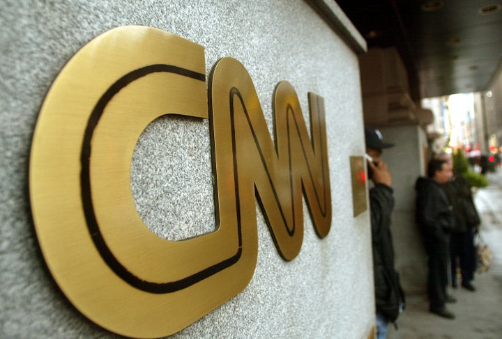 NEW YORK - NOVEMBER 12: The CNN sign is seen outside its headquarters November 12, 2002 in New York City. The proposed merger between CNN and Walt Disney Co.'s ABC News is progressing and could reach an agreement on principle by January, according to negotiators close to the deal. (Photo by Mario Tama/Getty Images)