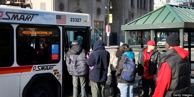 Passengers wait to board Suburban Mobility Authority for Regional Transportation (SMART) bus in Detroit, Michigan, U.S., on T