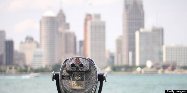Detroit downtown high-rises as seen across Detroit River from Windsor, Ontario.Old fashioned coin operated binoculars.