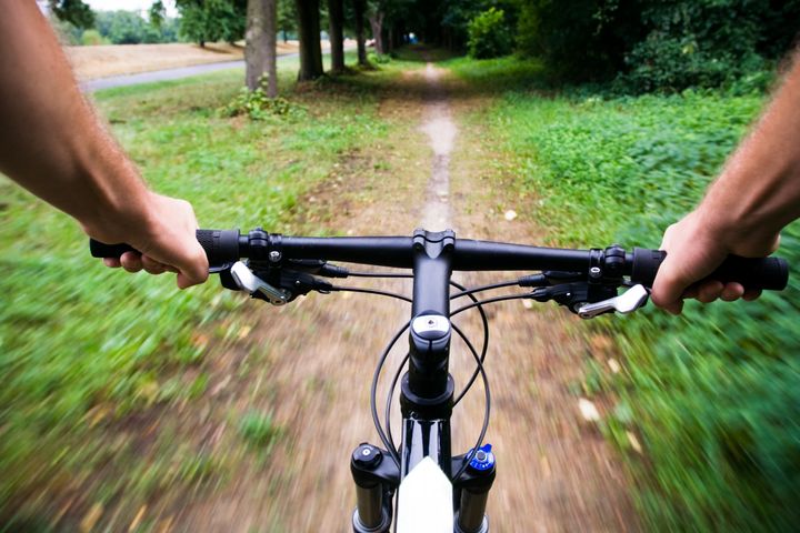 Mountain bike rider riding real fast, motion blur