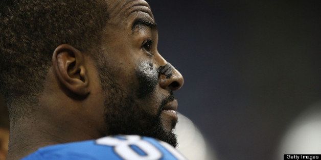 DETROIT, MI - DECEMBER 22: Calvin Johnson #81 of the Detroit Lions watches the video replay on the sidelines after breaking the NFL single season yardage record formally held by Jerry Rice during the game against the Atlanta Falcons at Ford Field on December 22, 2012 in Detroit, Michigan. The Falcons defeated the Lions 31-18. (Photo by Leon Halip/Getty Images)
