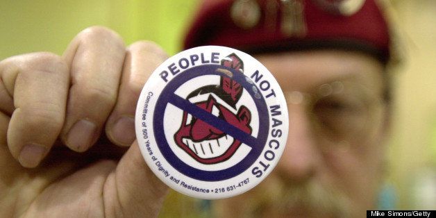 COLUMBUS, OH - JANUARY 1: Powwow attendee Sonny Hensley holds an anti-mascot button to protest using Indians as mascots for sports teams at the 10th Annual New Years Eve Sobriety Powwow January 1, 2003 in Columbus, Ohio. The Ohio Center for Native American Affairs sponsored the event, attracting people from several U.S. states as well as Canada. (Photo by Mike Simons/Getty Images)